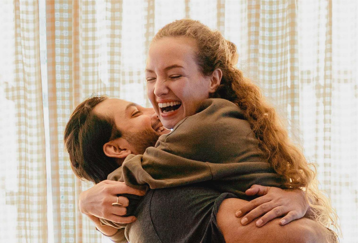 young couple hugging in new house
