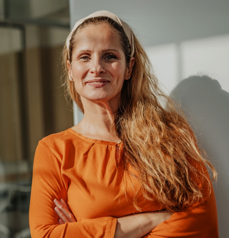 Female business owner standing outside her business
